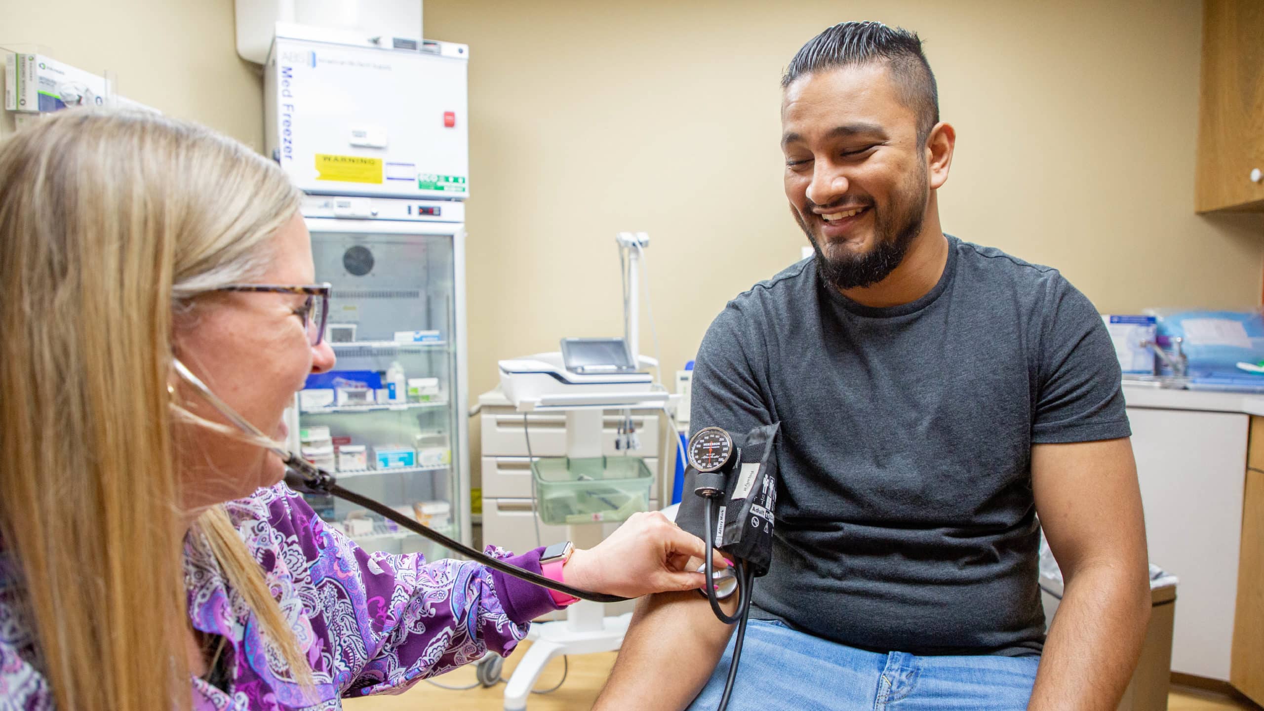 A Richfield Medical Group patient gets his blood pressure checked during an annual wellness exam