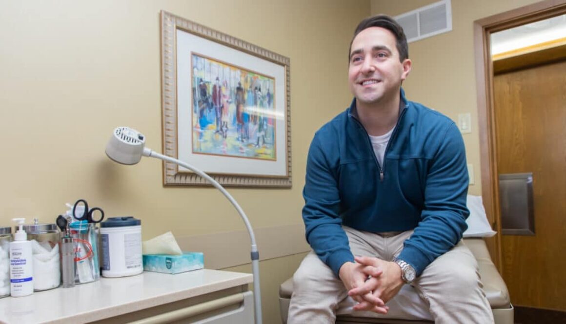 person sitting in doctors office