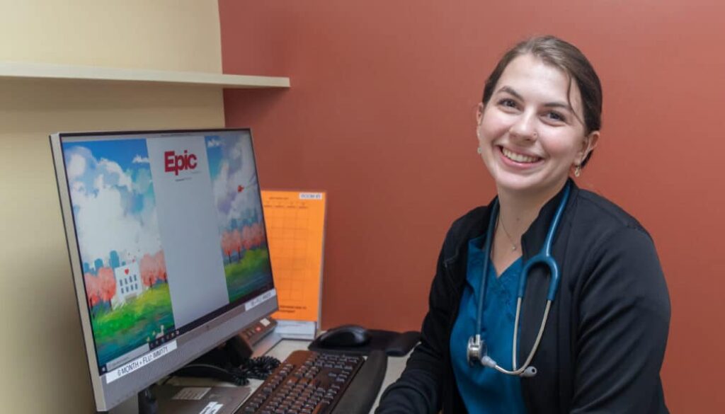 Woman at a desk smiling
